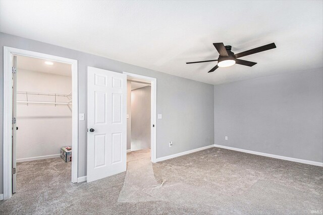 10059 Jefferson Rd, Osceola, IN 46561 - unfurnished bedroom with a spacious closet, carpet floors, a closet, and ceiling fan