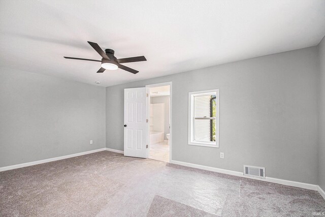 10059 Jefferson Rd, Osceola, IN 46561 - unfurnished bedroom with carpet floors, connected bathroom, and ceiling fan