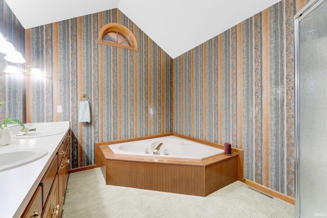 1102 Cabriolet Blvd, Auburn, IN 46706 - bathroom with double vanity, a garden tub, and lofted ceiling