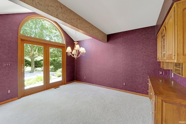 1102 Cabriolet Blvd, Auburn, IN 46706 - unfurnished dining area with lofted ceiling, a chandelier, and carpet flooring