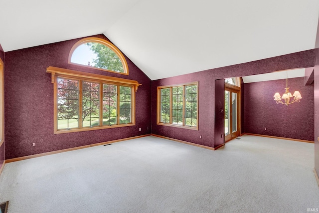 1102 Cabriolet Blvd, Auburn, IN 46706 - spare room featuring a chandelier, carpet flooring, and high vaulted ceiling