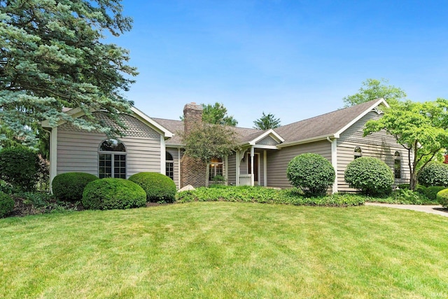 1102 Cabriolet Blvd, Auburn, IN 46706 - view of front facade with a front lawn, a chimney, and a shingled roof
