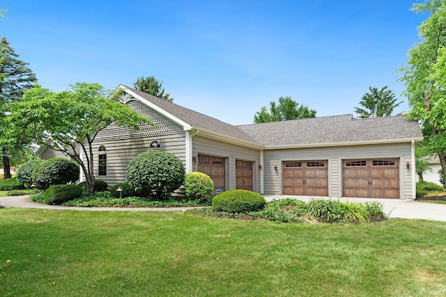 1102 Cabriolet Blvd, Auburn, IN 46706 - view of front of property with a garage, concrete driveway, and a front lawn