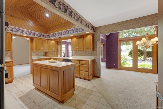 1102 Cabriolet Blvd, Auburn, IN 46706 - kitchen with light carpet, light countertops, a chandelier, a center island, and healthy amount of natural light