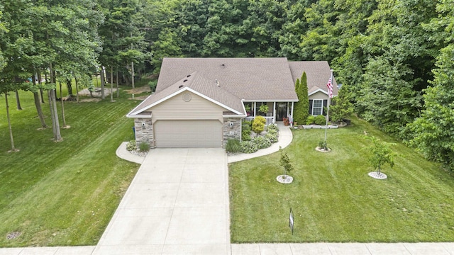 1403 Old Briar Trl, Auburn, IN 46706 - view of front of property featuring a garage, a front lawn, driveway, stone siding, and roof with shingles