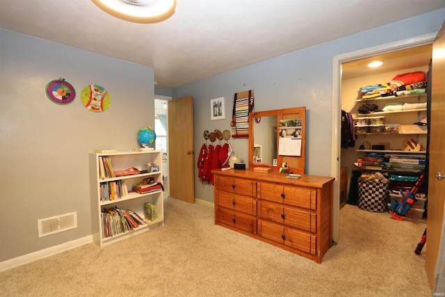 1015 W Battell St, South Bend, IN 46545 - bedroom with carpet flooring, a walk in closet, and a closet