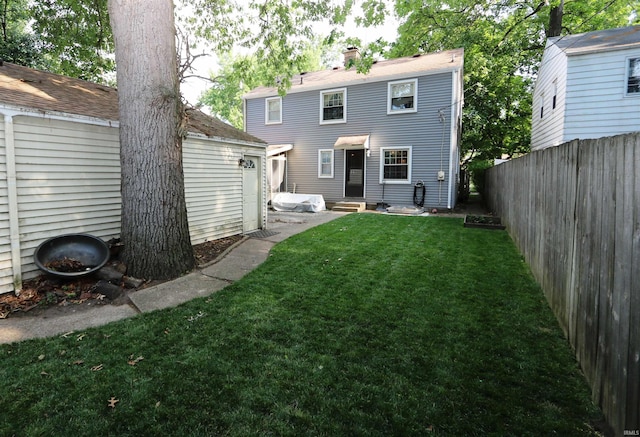 1015 W Battell St, South Bend, IN 46545 - rear view of property with entry steps and a chimney
