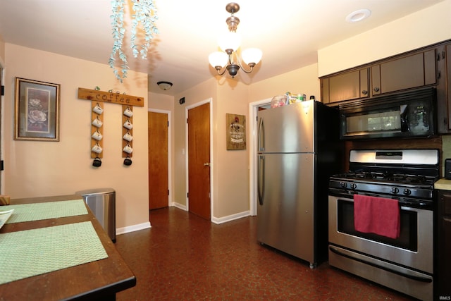 1015 W Battell St, South Bend, IN 46545 - kitchen featuring appliances with stainless steel finishes, a chandelier, and pendant lighting
