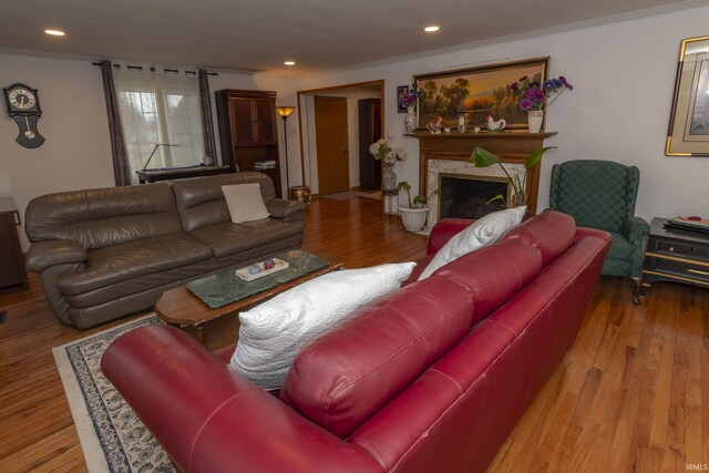 2714 Erskine Blvd, South Bend, IN 46614 - living room featuring wood finished floors, a fireplace, recessed lighting, and crown molding