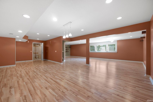 12828 Palazzo Blvd, Fort Wayne, IN 46845 - unfurnished living room featuring light wood finished floors and recessed lighting