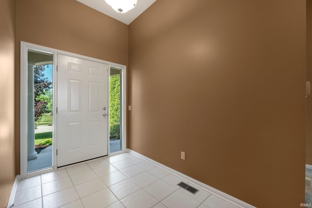 12828 Palazzo Blvd, Fort Wayne, IN 46845 - foyer entrance with plenty of natural light, a towering ceiling, and light tile patterned floors