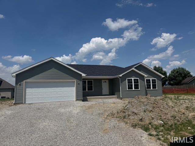 521 W Liberty St, Butler, IN 46721 - ranch-style home featuring an attached garage and driveway