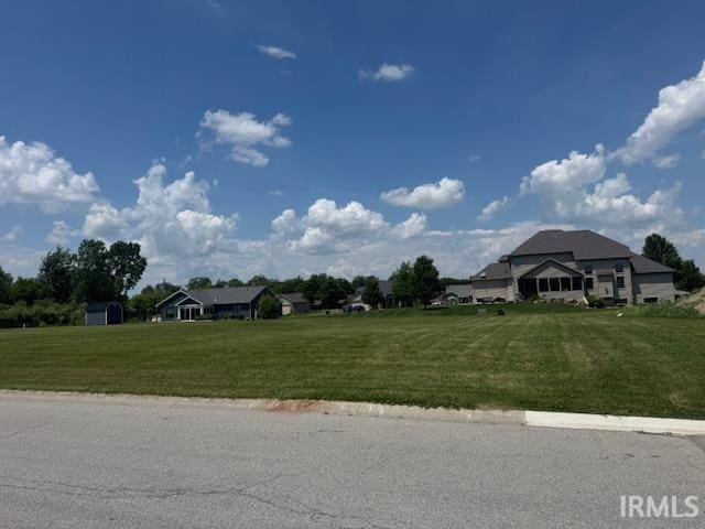 521 W Liberty St, Butler, IN 46721 - view of asphalt road featuring curbs