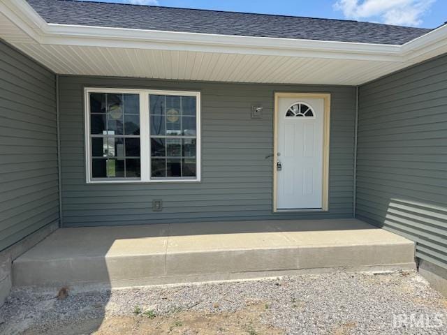 521 W Liberty St, Butler, IN 46721 - doorway to property with a shingled roof