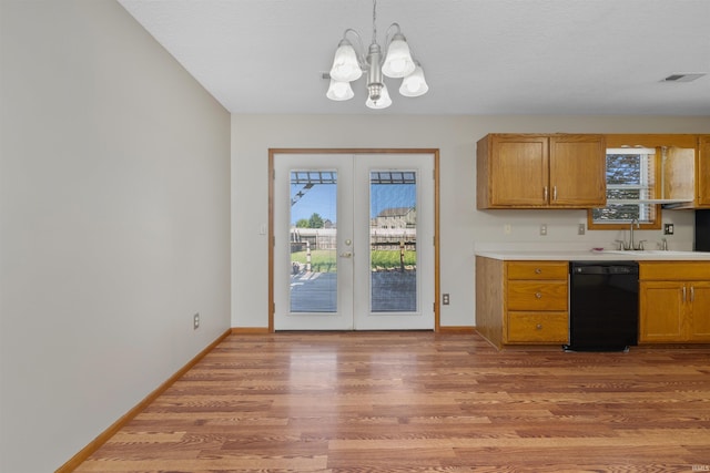 12531 Stoneboro Ct, Fort Wayne, IN 46845 - kitchen featuring dishwasher, french doors, light wood-style floors, a chandelier, and light countertops