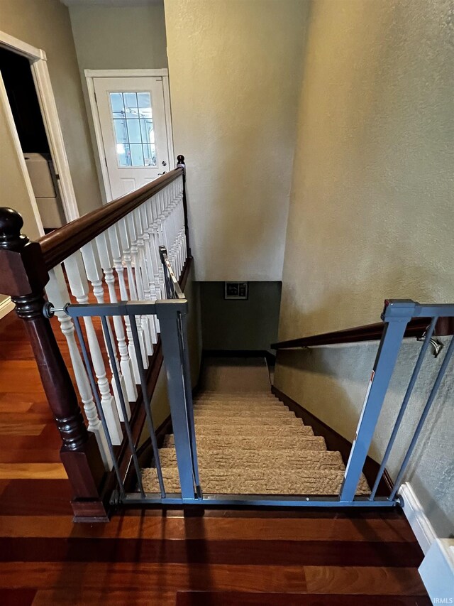 348 N Birdie Ln, Montgomery, IN 47558 - staircase featuring wood finished floors and a textured wall