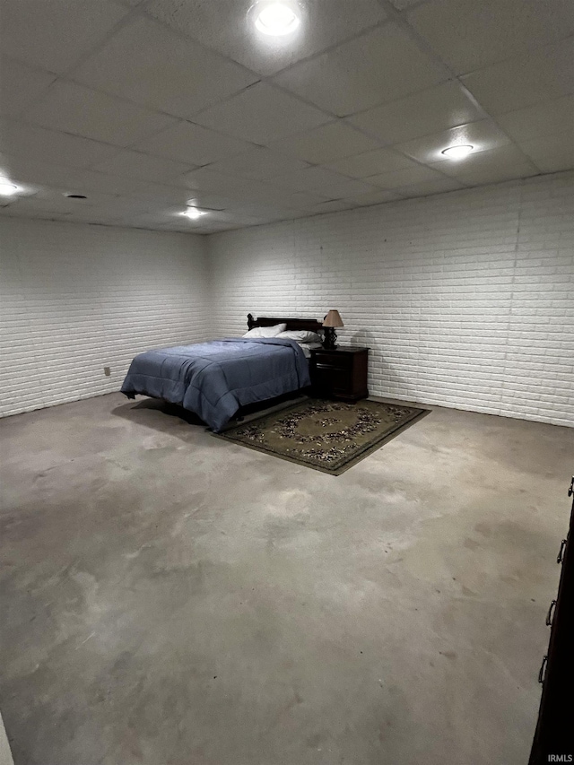 348 N Birdie Ln, Montgomery, IN 47558 - bedroom featuring unfinished concrete floors and a paneled ceiling