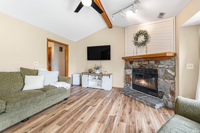 9026 Wallen Ln, Fort Wayne, IN 46825 - living area with wood finished floors, a fireplace, ceiling fan, and track lighting