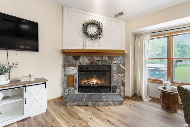 9026 Wallen Ln, Fort Wayne, IN 46825 - detailed view of wood finished floors and a fireplace