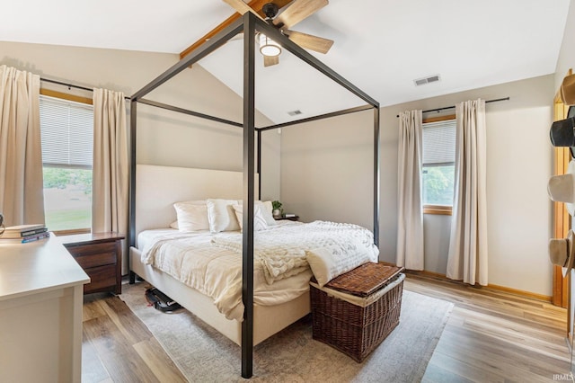 9026 Wallen Ln, Fort Wayne, IN 46825 - bedroom featuring light wood finished floors, vaulted ceiling, and ceiling fan