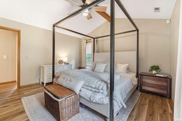 9026 Wallen Ln, Fort Wayne, IN 46825 - bedroom with light wood-type flooring, lofted ceiling, and ceiling fan