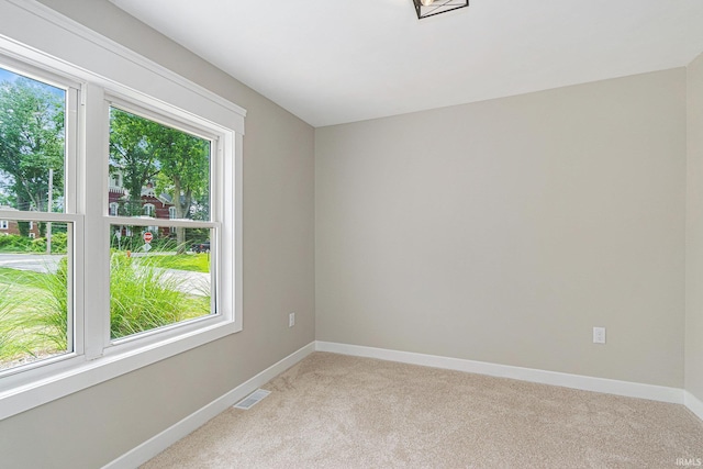 121 W Front St, New Carlisle, IN 46552 - unfurnished room featuring light colored carpet and baseboards