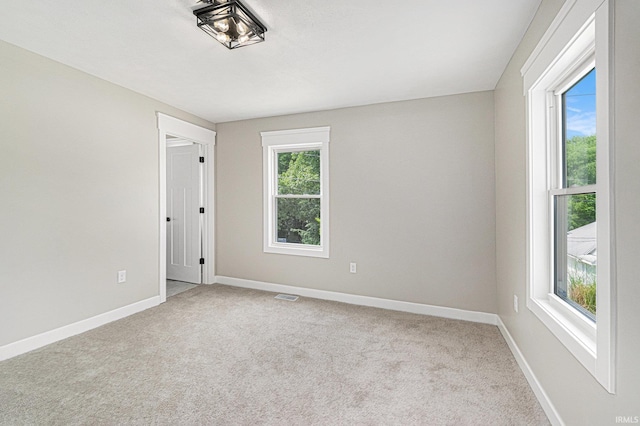 121 W Front St, New Carlisle, IN 46552 - empty room with carpet floors and baseboards