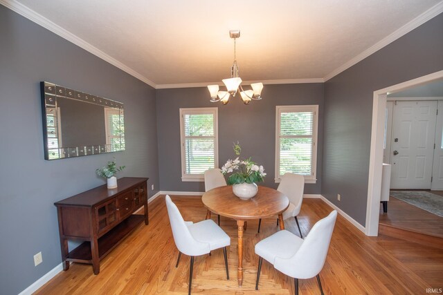 3801 W Capilano Dr, West Lafayette, IN 47906 - dining area featuring a chandelier, ornamental molding, and light wood-style flooring