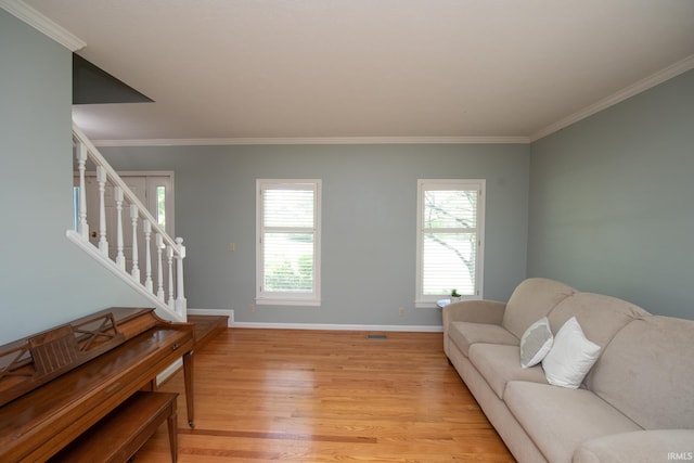 3801 W Capilano Dr, West Lafayette, IN 47906 - living area featuring light wood-style flooring, ornamental molding, and stairway