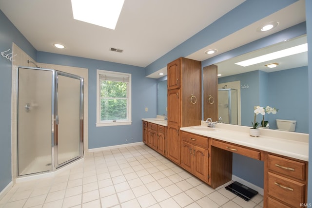 3801 W Capilano Dr, West Lafayette, IN 47906 - bathroom with a stall shower, vanity, recessed lighting, a skylight, and tile patterned flooring