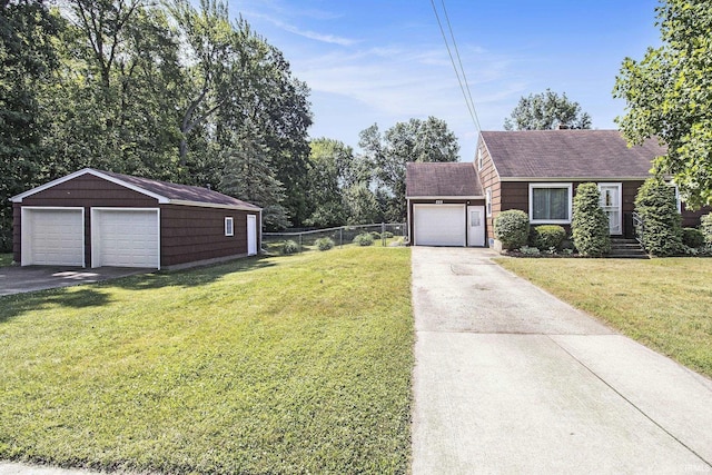 825 W Catalpa Dr, Mishawaka, IN 46545 - view of front of house featuring roof with shingles, a garage, and an outbuilding