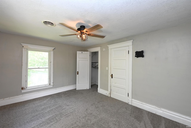 421 S Franklin St, Winamac, IN 46996 - unfurnished bedroom with carpet flooring and a ceiling fan
