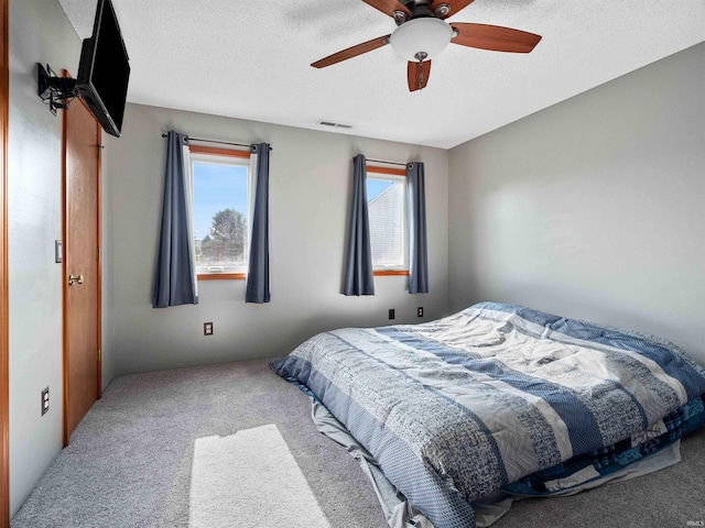 803 Larkwillow Ct, Huntertown, IN 46748 - carpeted bedroom featuring a textured ceiling and a ceiling fan