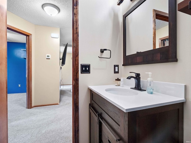 803 Larkwillow Ct, Huntertown, IN 46748 - bathroom featuring vanity and a textured ceiling