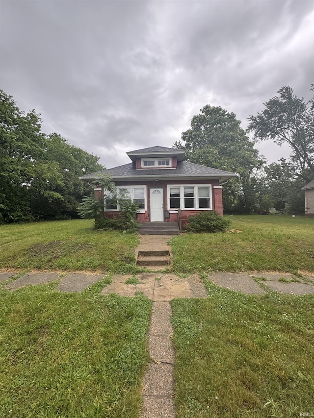 628 Birdsell St, South Bend, IN 46628 - view of front of property featuring a front yard and roof with shingles