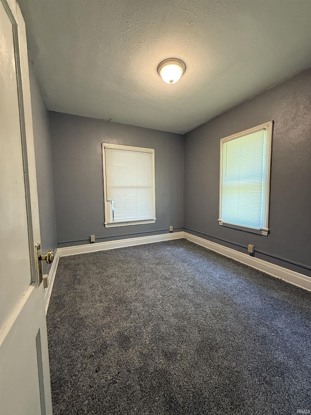 628 Birdsell St, South Bend, IN 46628 - carpeted empty room with a textured ceiling and baseboards