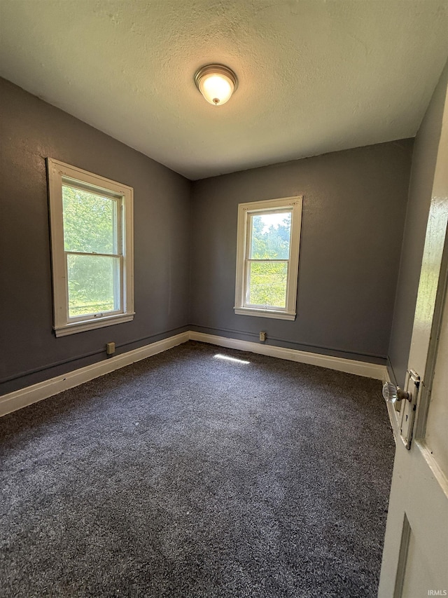 628 Birdsell St, South Bend, IN 46628 - carpeted empty room with a textured ceiling and baseboards