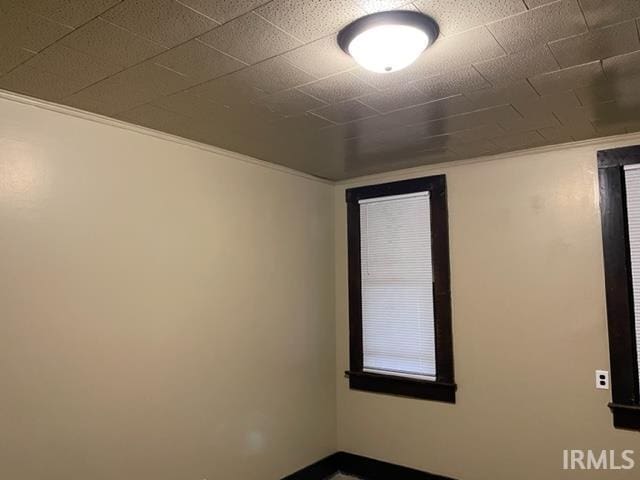 436 W Williams St, Fort Wayne, IN 46802 - spare room featuring baseboards and ornamental molding