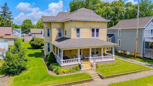240 Elm St, Wabash, IN 46992 - view of front facade featuring covered porch, roof with shingles, a front yard, and a chimney