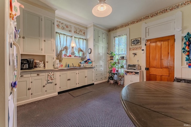 240 Elm St, Wabash, IN 46992 - kitchen featuring freestanding refrigerator, dark carpet, and white cabinets