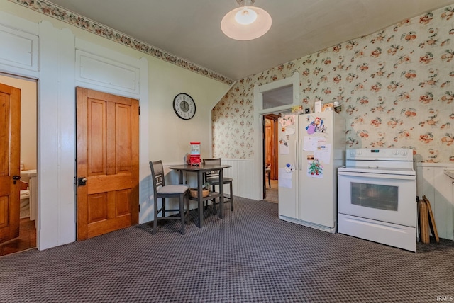 240 Elm St, Wabash, IN 46992 - kitchen with white appliances, dark colored carpet, wallpapered walls, and wainscoting
