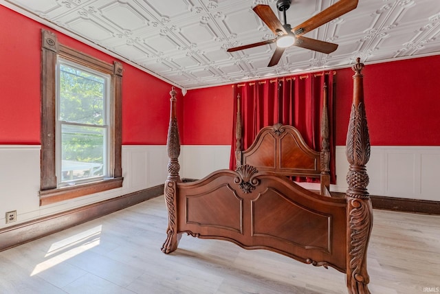 240 Elm St, Wabash, IN 46992 - bedroom featuring an ornate ceiling, a wainscoted wall, and wood finished floors