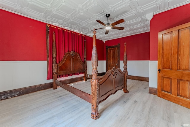 240 Elm St, Wabash, IN 46992 - bedroom featuring wood finished floors, an ornate ceiling, wainscoting, and ceiling fan
