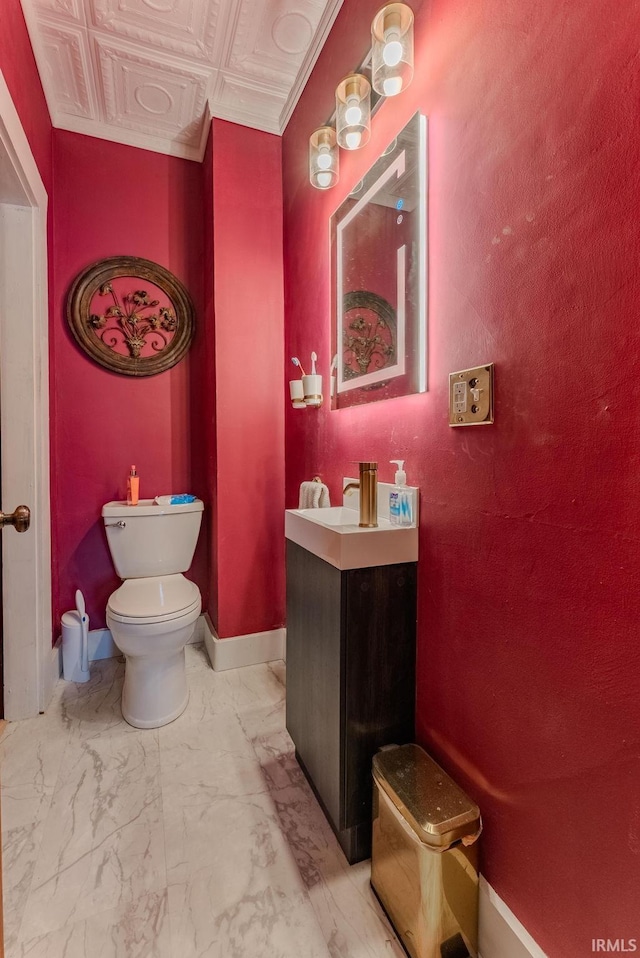 240 Elm St, Wabash, IN 46992 - bathroom featuring vanity, marble look tiles, and an ornate ceiling