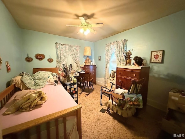 819 Race St, Logansport, IN 46947 - bedroom with light colored carpet and ceiling fan