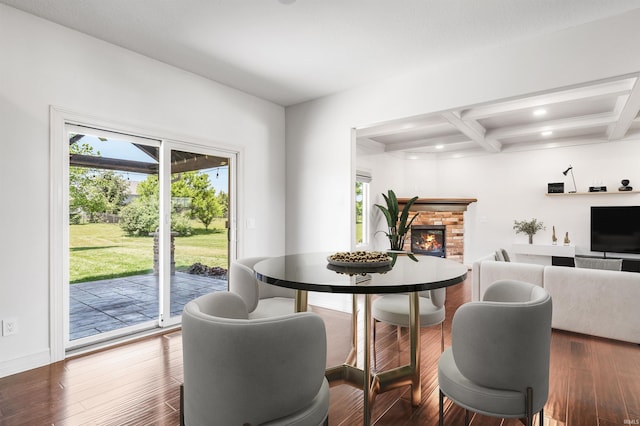 3032 Treviso Way, Fort Wayne, IN 46814 - dining space with healthy amount of natural light, beamed ceiling, a brick fireplace, wood finished floors, and recessed lighting