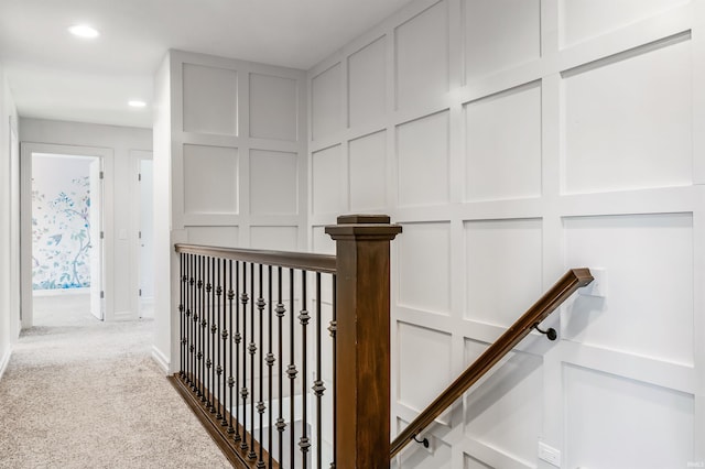 3032 Treviso Way, Fort Wayne, IN 46814 - corridor with a decorative wall, carpet flooring, recessed lighting, and an upstairs landing