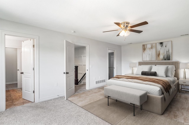 3032 Treviso Way, Fort Wayne, IN 46814 - carpeted bedroom with a walk in closet, a ceiling fan, and ensuite bathroom