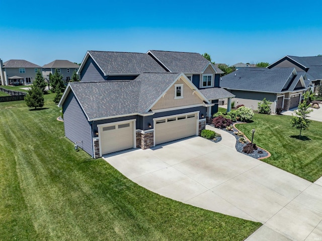 3032 Treviso Way, Fort Wayne, IN 46814 - craftsman-style house with driveway, a residential view, a front lawn, a garage, and stone siding