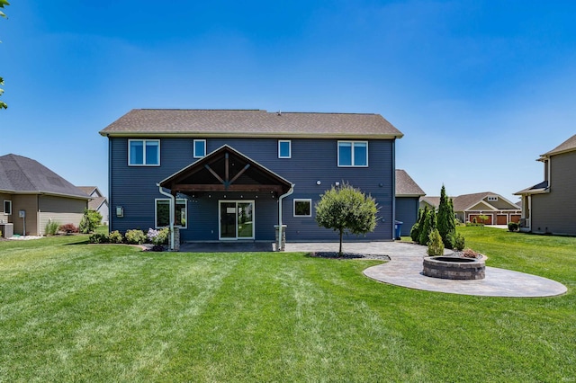 3032 Treviso Way, Fort Wayne, IN 46814 - rear view of property with a patio, an outdoor fire pit, and a lawn